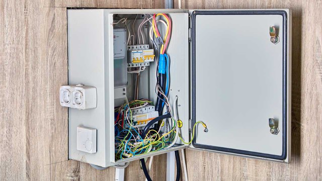 A home electrical panel box with fuses. Find out what happens when a fuse blows in a home power box.